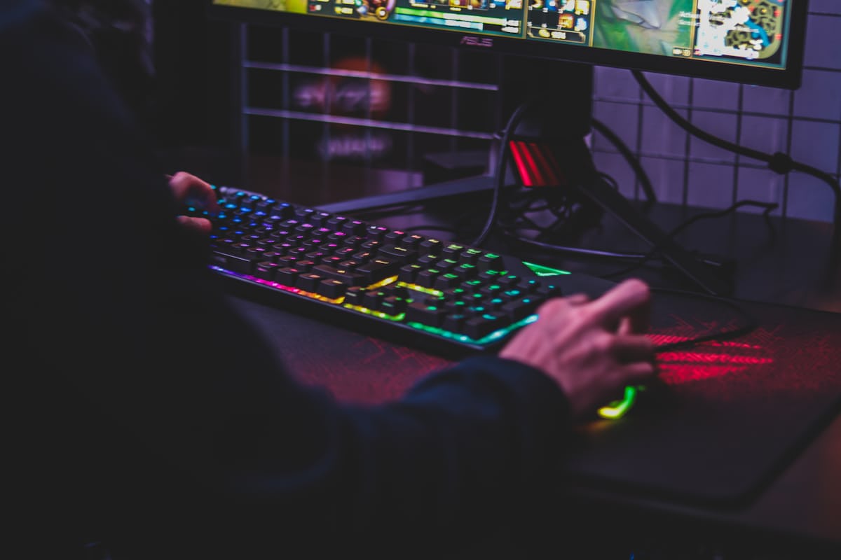 Hands on a game controller during a night session
