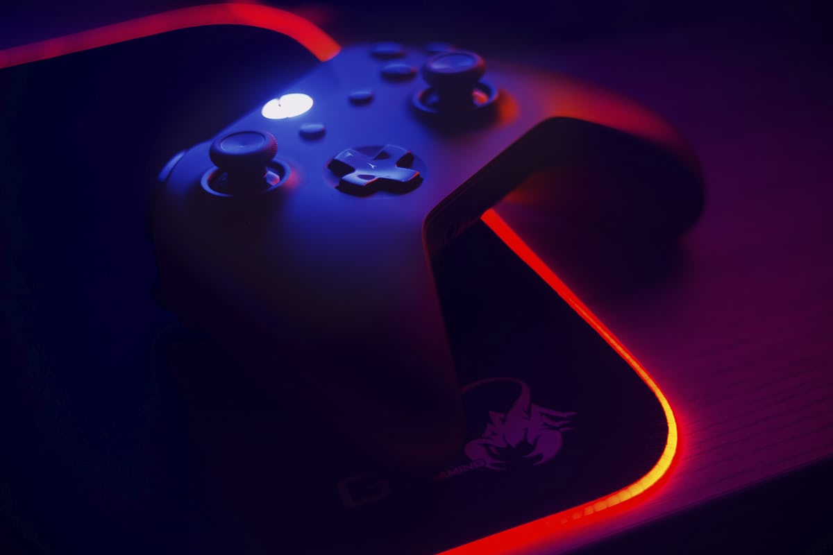 Close-up of a mechanical keyboard with warm backlighting