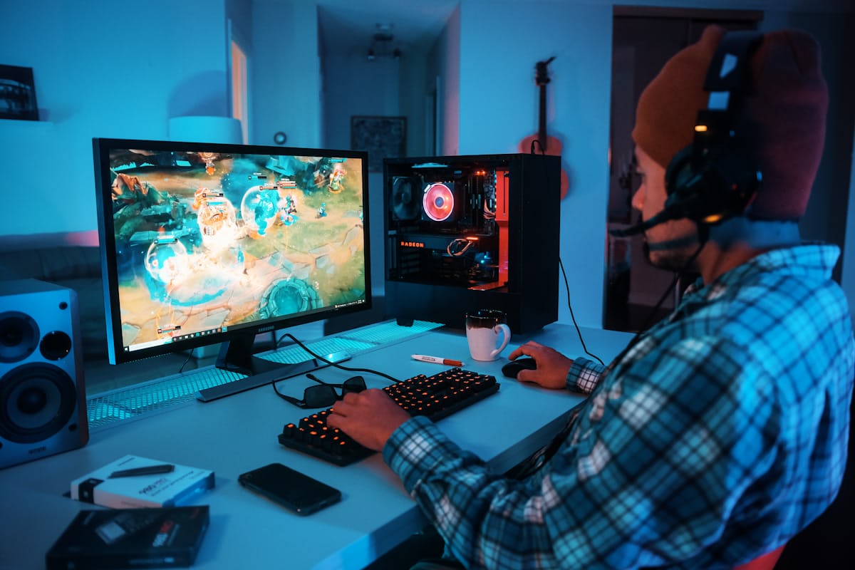 Editor reviewing games on laptop and tablet